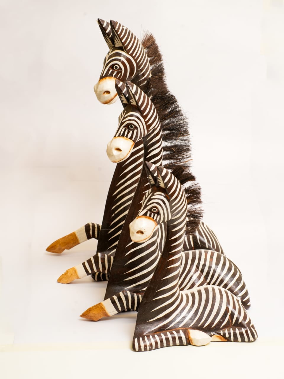 HAND-CARVED WOODEN ZEBRA TRIO