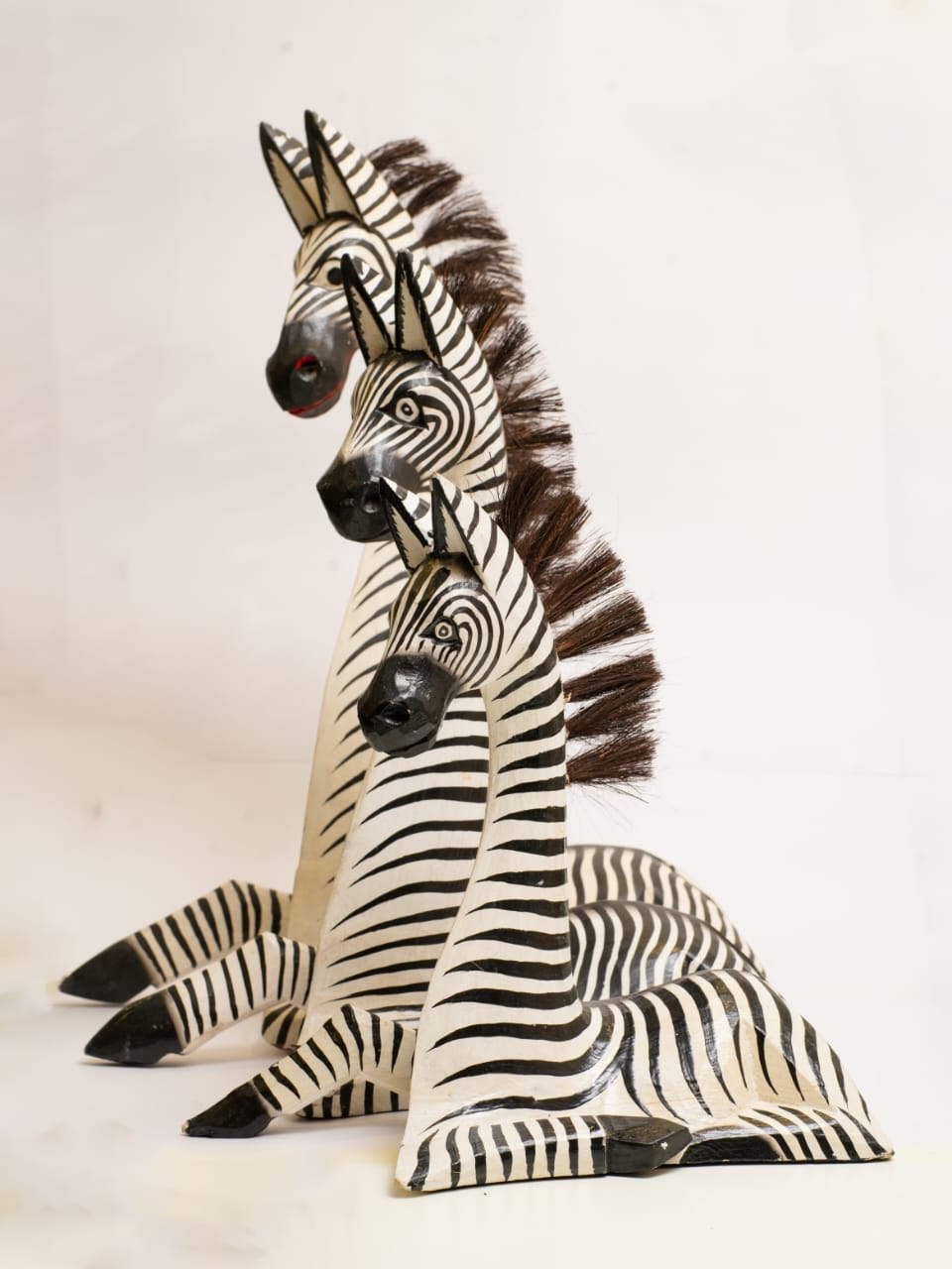 HAND-CARVED WOODEN ZEBRA TRIO