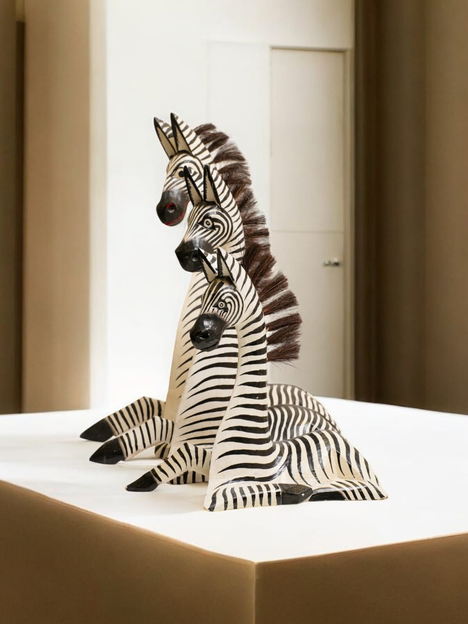 HAND-CARVED WOODEN ZEBRA TRIO