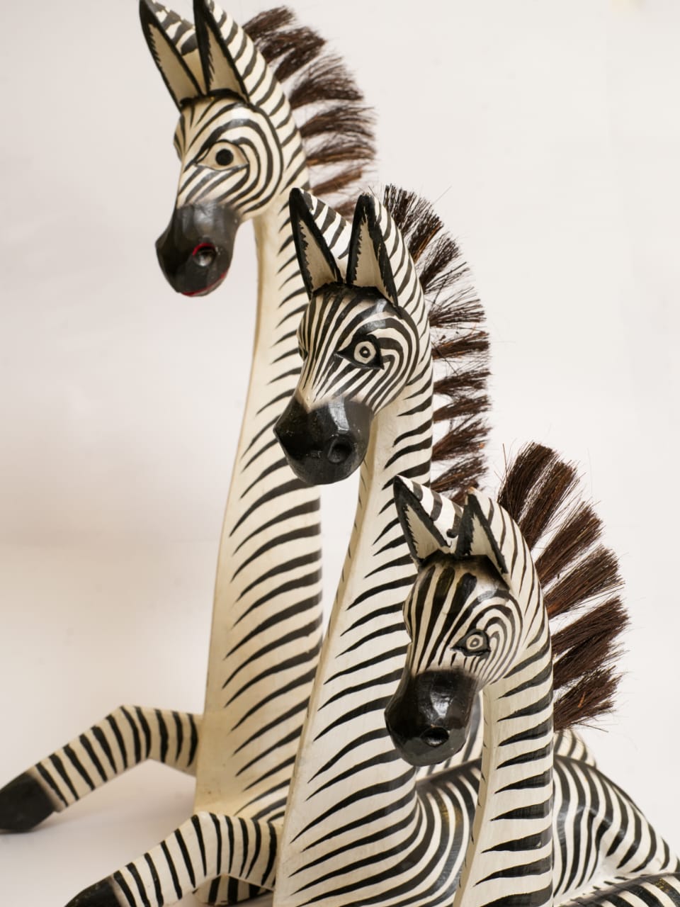 HAND-CARVED WOODEN ZEBRA TRIO