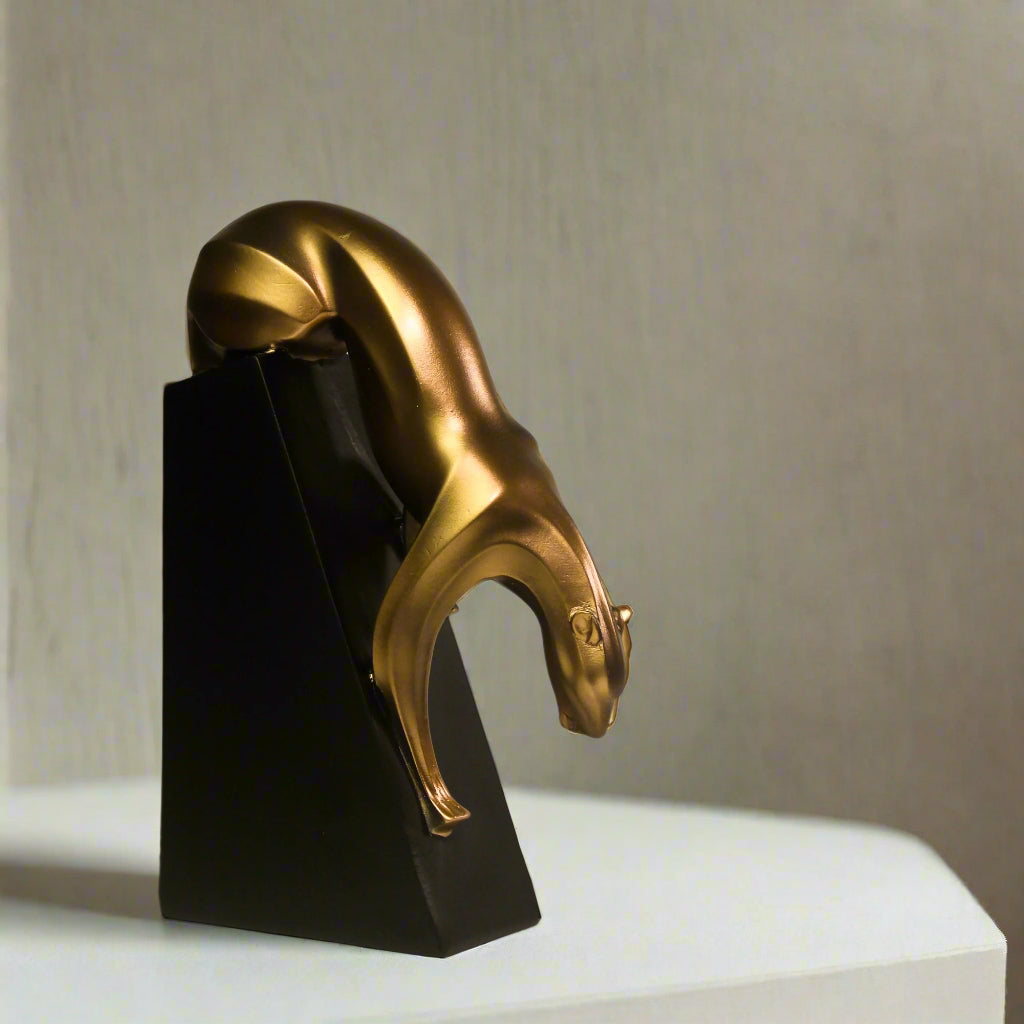 Resin panther statue in an Art Deco style with a brushed bronze surface