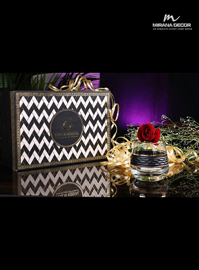 Elegant black and gold glasses in premium wooden box