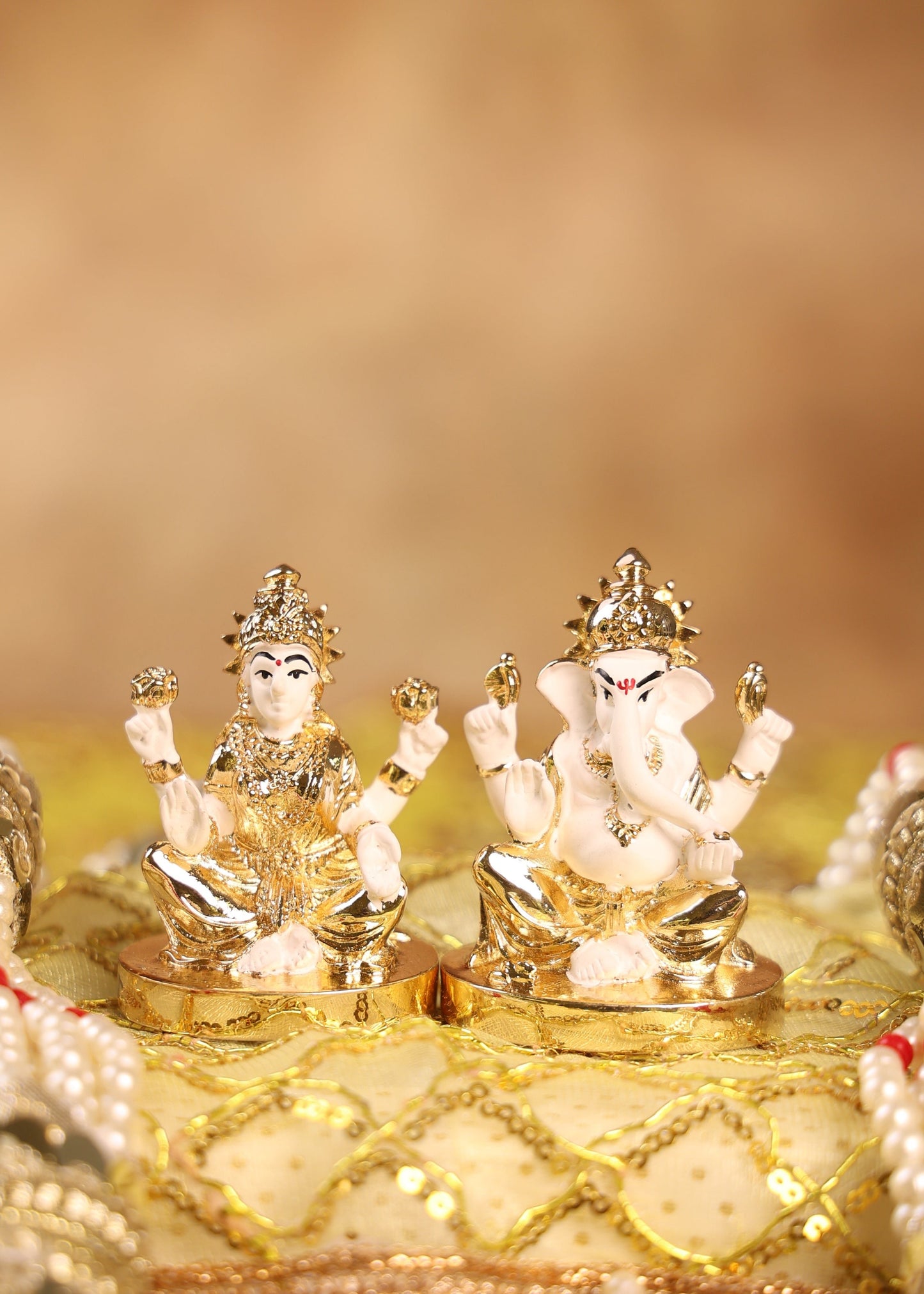 Divine Duo Figurines – Lakshmi & Ganesha In Gold