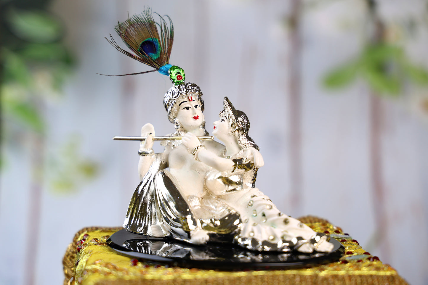 Silver Plated White Sitting Radha Krishna on a Black Acrylic Plate
