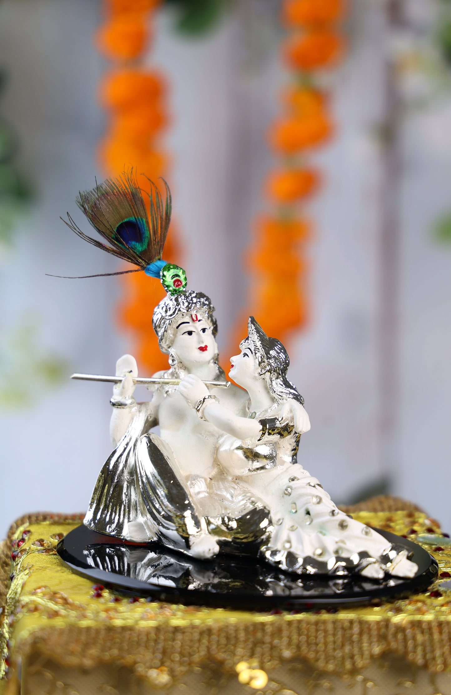 Silver Plated White Sitting Radha Krishna on a Black Acrylic Plate