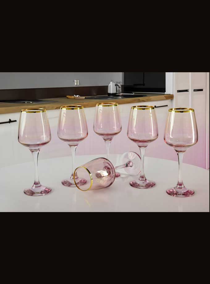 Stylish pink wine glasses with gold trim in gift box
