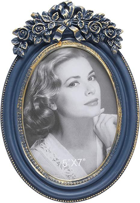 Antique-style navy blue oval photo frame, perfect for displaying cherished memories