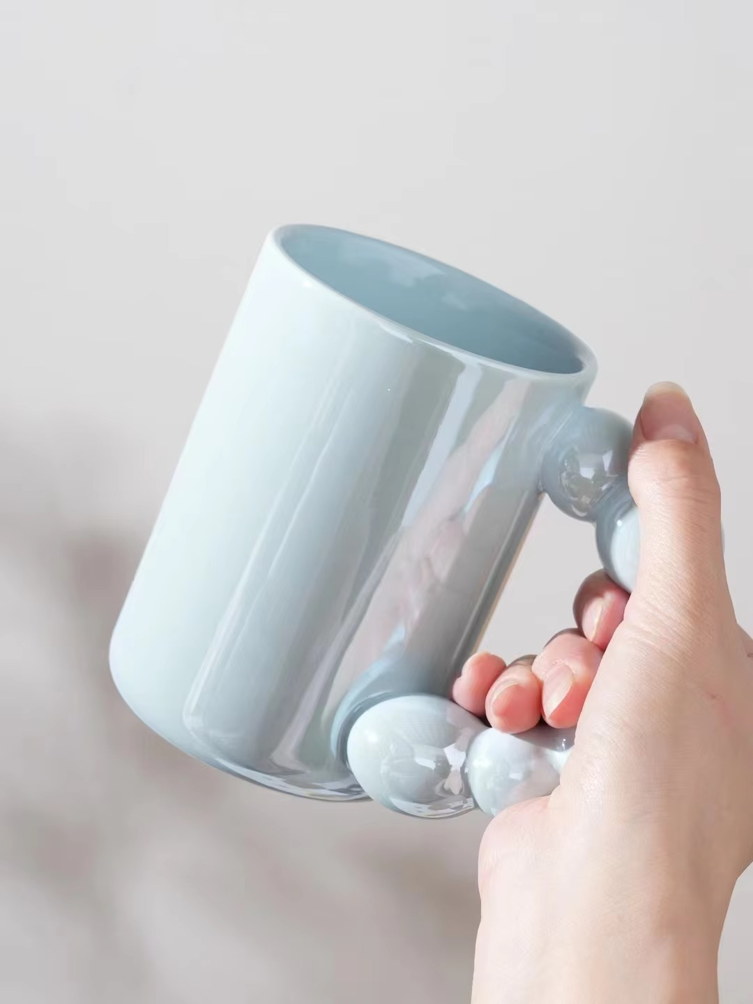 Modern Glossy Mug with Bubble Handle – Minimalist Elegance