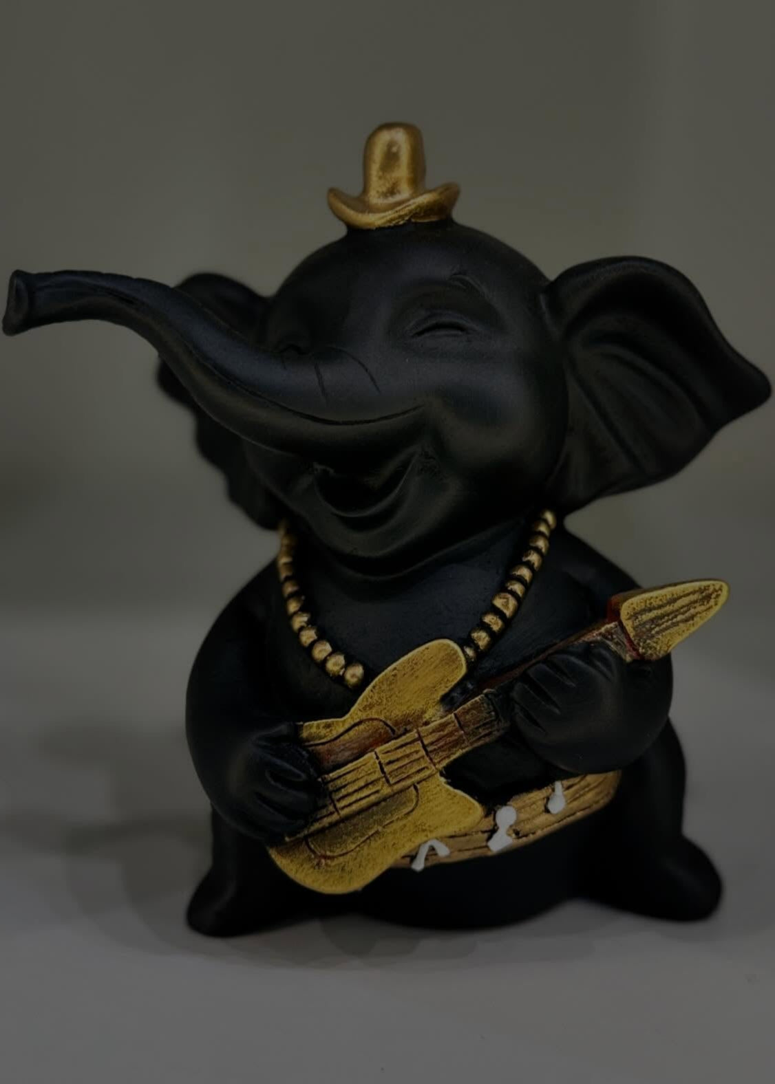 Baby Elephant Playing Musical Instrument Sculpture