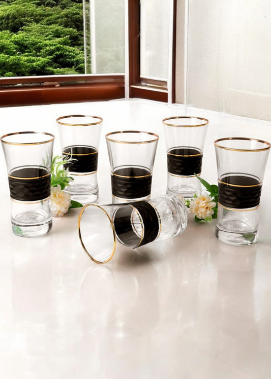 Elegant black and gold juice glasses in gift box