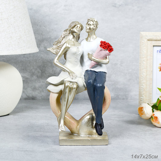 Elegant polyresin showpiece of a couple in a romantic pose, ideal for home or gift decor

