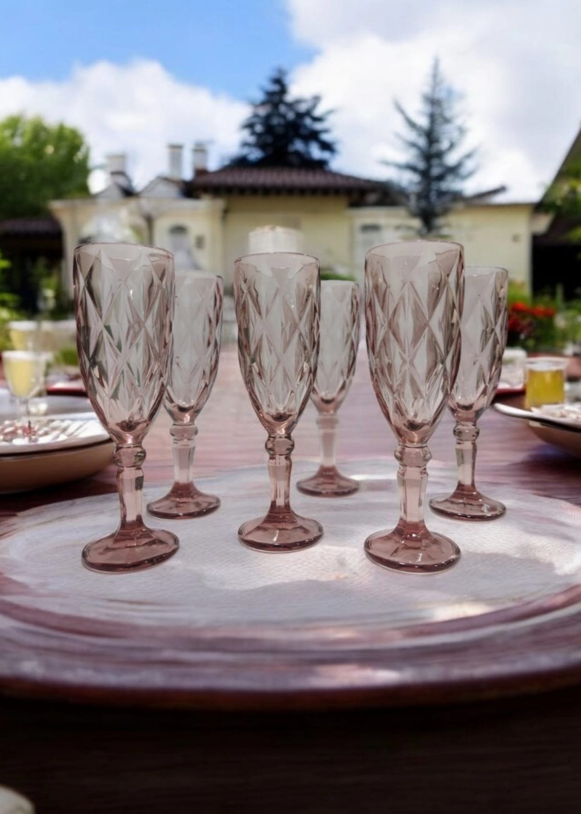 Three pink vintage-style champagne glasses