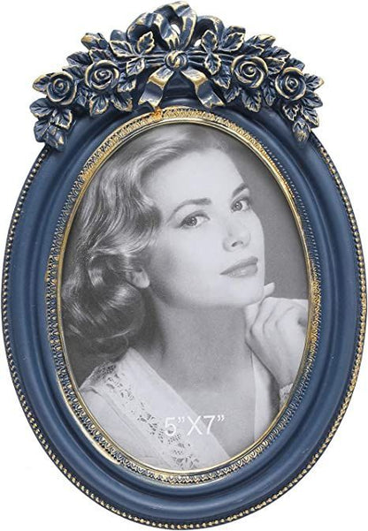Antique-style navy blue oval photo frame, perfect for displaying cherished memories

